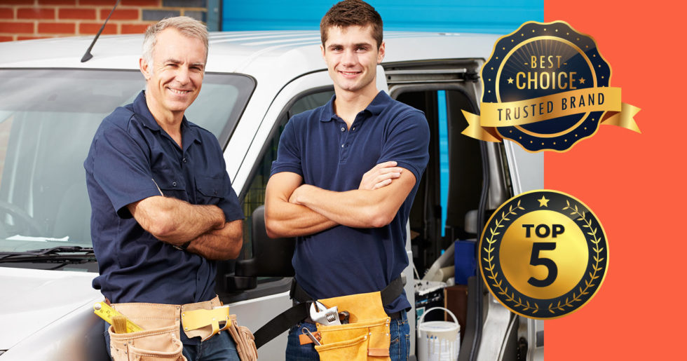 Photo of two plumbers in front of a car