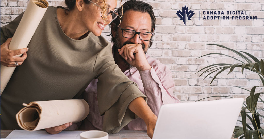 Canada Digital Adoption Program Eligibility - two people looking at a laptop