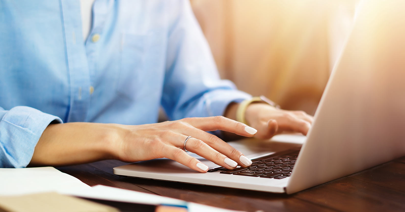 Answers to the Top 6 Questions About Digital Marketing 5 Hands on a laptop keyboard