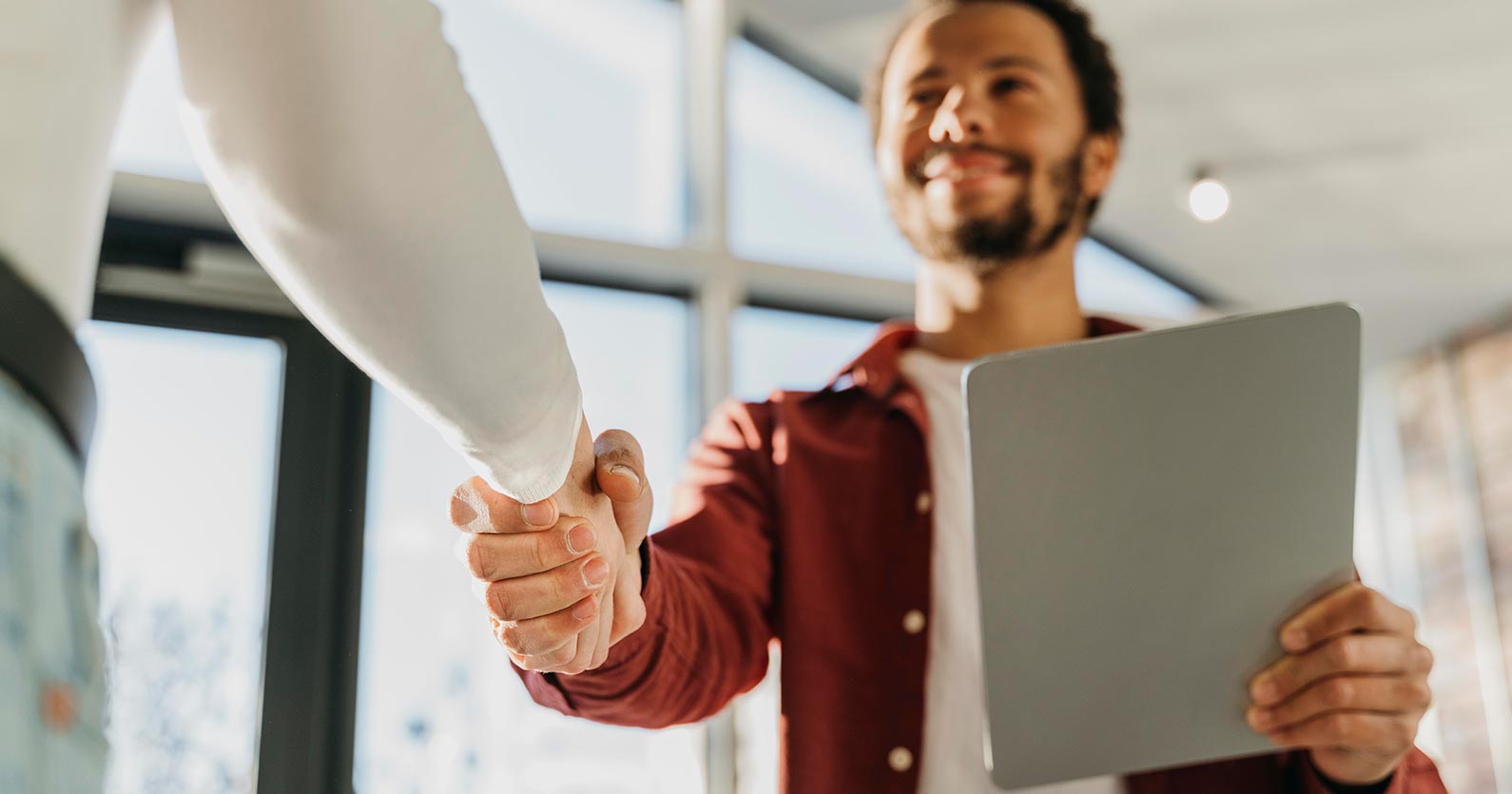 5 Simple Ways To Recession-proof Your Business 3 people shaking hands