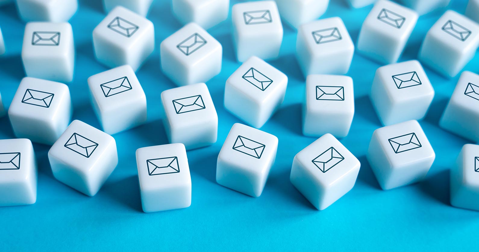 image of cubes with envelopes printed on them